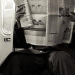401px-2009_reading_newspaper_NYC_4328271821